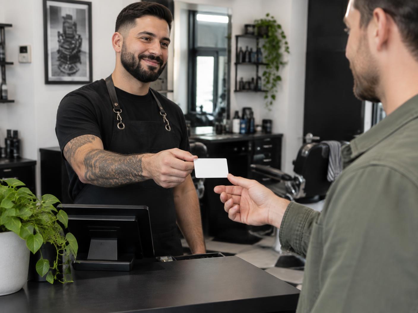 Barber or service counter offering a card after service